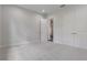 A clean bedroom with carpet flooring featuring a closet and open entry at 3898 Southern Valley Loop, Brooksville, FL 34601