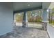 Spacious covered front porch featuring stone detailing and an inviting outdoor space at 3898 Southern Valley Loop, Brooksville, FL 34601
