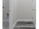 Hallway featuring a utility closet and laminate flooring at 3898 Southern Valley Loop, Brooksville, FL 34601