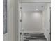 Hallway view shows wood-look flooring and neutral paint at 3898 Southern Valley Loop, Brooksville, FL 34601