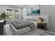 Stylishly decorated main bedroom with natural light, accent wall art, and neutral tones at 3898 Southern Valley Loop, Brooksville, FL 34601