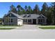 Charming home with a paved driveway, attached garage, manicured lawn and a traditional architectural style at 4676 Hickory Oak Dr, Brooksville, FL 34601