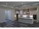 Bright, modern kitchen with white cabinets, center island, stainless steel appliances, and an open layout at 4676 Hickory Oak Dr, Brooksville, FL 34601