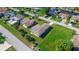 Aerial view of the house shows lawn, landscaping, and neighborhood at 7332 Mako Dr, Hudson, FL 34667
