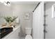 Modern bathroom featuring a black vessel sink, white cabinets, and shower with curtain at 7332 Mako Dr, Hudson, FL 34667