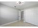 Neutral bedroom with tile floors, closet, and natural light at 7332 Mako Dr, Hudson, FL 34667