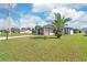 Charming single-story home with well-manicured lawn and mature palm tree at 7332 Mako Dr, Hudson, FL 34667