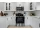 Kitchen featuring white cabinetry, stainless appliances, and bright countertops at 7332 Mako Dr, Hudson, FL 34667