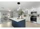 Stylish kitchen with white cabinets, stainless appliances, and a large island at 7332 Mako Dr, Hudson, FL 34667
