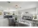 Inviting living room boasts an open floor plan, contemporary decor, and seamless flow into the adjacent kitchen at 7332 Mako Dr, Hudson, FL 34667