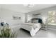 Relaxing main bedroom with large windows and neutral-toned decor at 7332 Mako Dr, Hudson, FL 34667