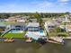 Waterfront property with private dock and swimming pool, seen from above at 7637 Hatteras Dr, Hudson, FL 34667