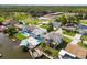 Bird's-eye view of canal-front homes showcasing pools and boat docks at 7637 Hatteras Dr, Hudson, FL 34667