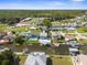 Aerial view of waterfront homes with private docks and swimming pools at 7637 Hatteras Dr, Hudson, FL 34667