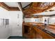 Basement bar with wood bar top and string lights at 7637 Hatteras Dr, Hudson, FL 34667