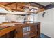 Relaxing basement bar with wooden details and lighting at 7637 Hatteras Dr, Hudson, FL 34667
