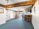 Finished basement with a wet bar and seating area at 7637 Hatteras Dr, Hudson, FL 34667