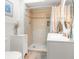 Bathroom with a large walk-in shower and updated vanity at 7637 Hatteras Dr, Hudson, FL 34667