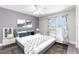 Main bedroom with access to a balcony featuring stylish decor at 7637 Hatteras Dr, Hudson, FL 34667