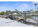 Boat lift with dock and canal views at 7637 Hatteras Dr, Hudson, FL 34667