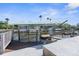 Covered boat lift with dock and canal access at 7637 Hatteras Dr, Hudson, FL 34667