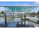 Convenient boat lift with covered shelter at 7637 Hatteras Dr, Hudson, FL 34667