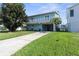 Light blue two-story house with balcony and garage at 7637 Hatteras Dr, Hudson, FL 34667
