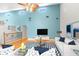 Living room with high ceilings, large TV, and comfortable seating at 7637 Hatteras Dr, Hudson, FL 34667