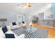Spacious living room with hardwood floors and stylish furnishings at 7637 Hatteras Dr, Hudson, FL 34667