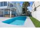 Inviting pool area with hot tub and patio at 7637 Hatteras Dr, Hudson, FL 34667