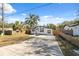 Newly renovated home with a spacious yard and concrete driveway at 9413 N 16Th St, Tampa, FL 33612