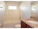 Clean bathroom with granite countertop, shower/tub combo, and tiled walls at 11531 Weston Course Loop, Riverview, FL 33579