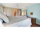 Bedroom with light walls and wood floors at 12119 Sunny Glen Ln # H1, Hudson, FL 34669