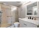 Clean bathroom with marble vanity and walk-in shower at 12119 Sunny Glen Ln # H1, Hudson, FL 34669
