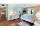 Bedroom with light walls and wood floors at 12119 Sunny Glen Ln # H1, Hudson, FL 34669