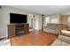 Living room with hardwood floors, sofas, and a fireplace at 12119 Sunny Glen Ln # H1, Hudson, FL 34669