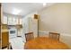 Bright kitchen features white appliances and wood cabinets at 12119 Sunny Glen Ln # H1, Hudson, FL 34669