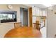 Kitchen with view into living room and white cabinets at 12119 Sunny Glen Ln # H1, Hudson, FL 34669