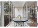 Enjoy this screened-in patio with outdoor seating and a view of the community at 12119 Sunny Glen Ln # H1, Hudson, FL 34669