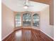 Hardwood floors and a bay window brighten this bedroom at 13626 Bryndlewood Ct, Hudson, FL 34669