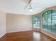 Spacious bedroom featuring hardwood floors and a large window at 13626 Bryndlewood Ct, Hudson, FL 34669