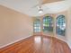 Bright bedroom with hardwood floors and large bay windows at 13626 Bryndlewood Ct, Hudson, FL 34669