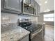 Stainless steel range and microwave in updated kitchen at 13626 Bryndlewood Ct, Hudson, FL 34669