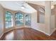 Spacious living room featuring hardwood floors and bay window at 13626 Bryndlewood Ct, Hudson, FL 34669