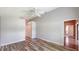 Bright bedroom with wood-look flooring and ample closet space at 13626 Bryndlewood Ct, Hudson, FL 34669