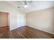 Comfortable bedroom with hardwood floors and double door closet at 13626 Bryndlewood Ct, Hudson, FL 34669