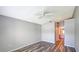 Spacious bedroom with wood-look flooring and ceiling fan at 13626 Bryndlewood Ct, Hudson, FL 34669