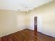 Well-lit bedroom with hardwood floors and double door closet at 13626 Bryndlewood Ct, Hudson, FL 34669