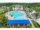 Large community pool with plenty of lounge chairs and tables at 4056 Southern Valley Loop, Brooksville, FL 34601