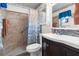 Bathroom with shower stall, tiled walls, and vanity at 3391 Lambert Ave, Spring Hill, FL 34608